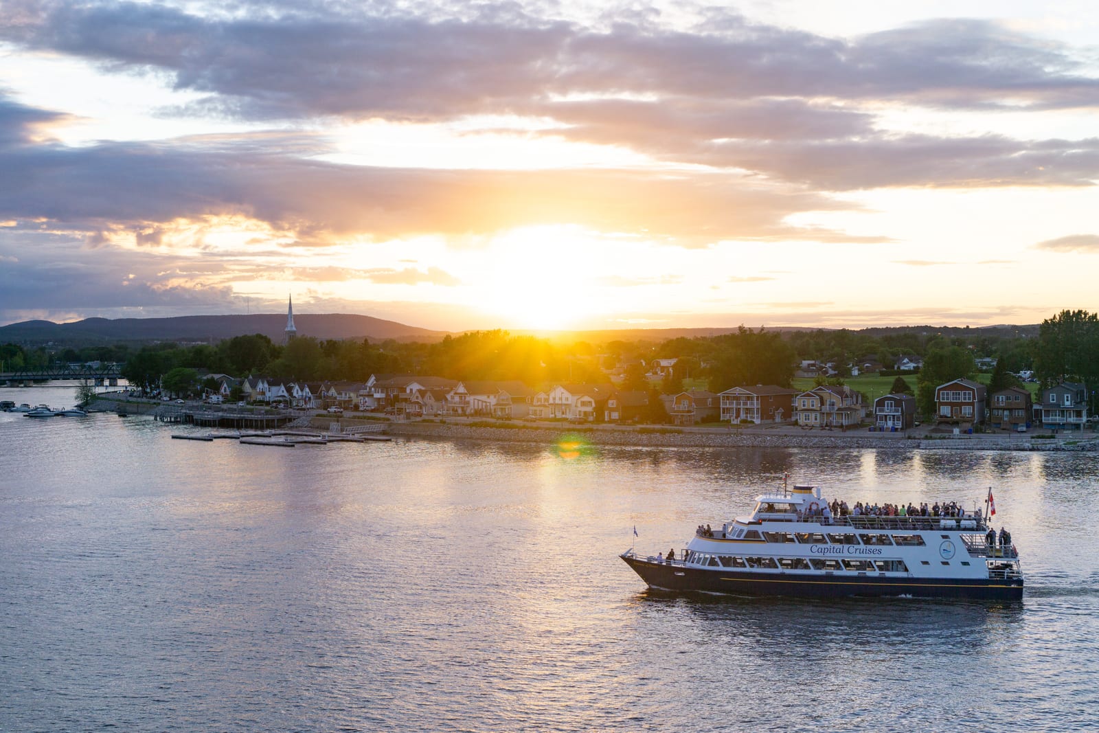 Ottawa riverfront at sunset with ferry
